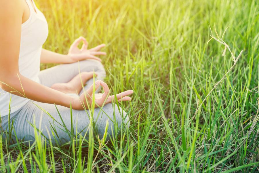 Person practicing slow breathing and mindful calm meditation